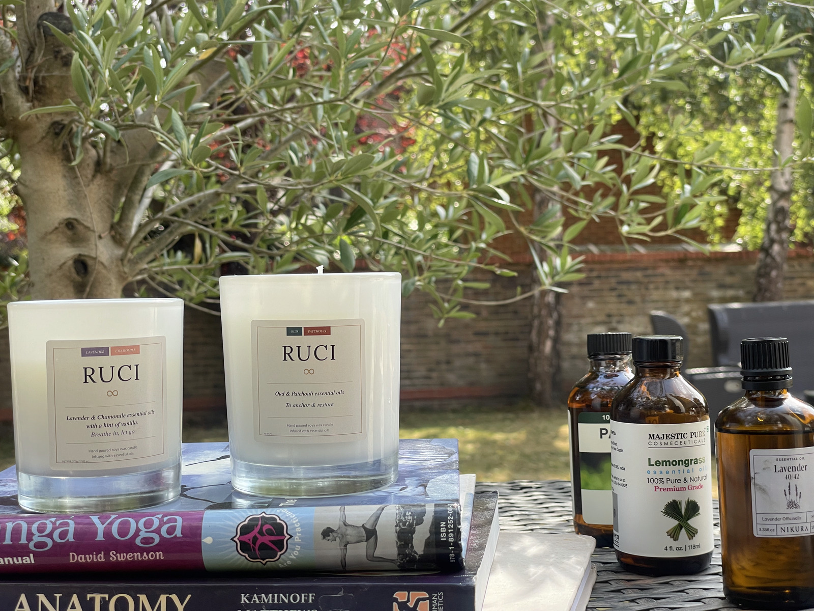 RUCI candles with essential oils in garden